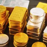 Gold price increase concept with gold bars and coins